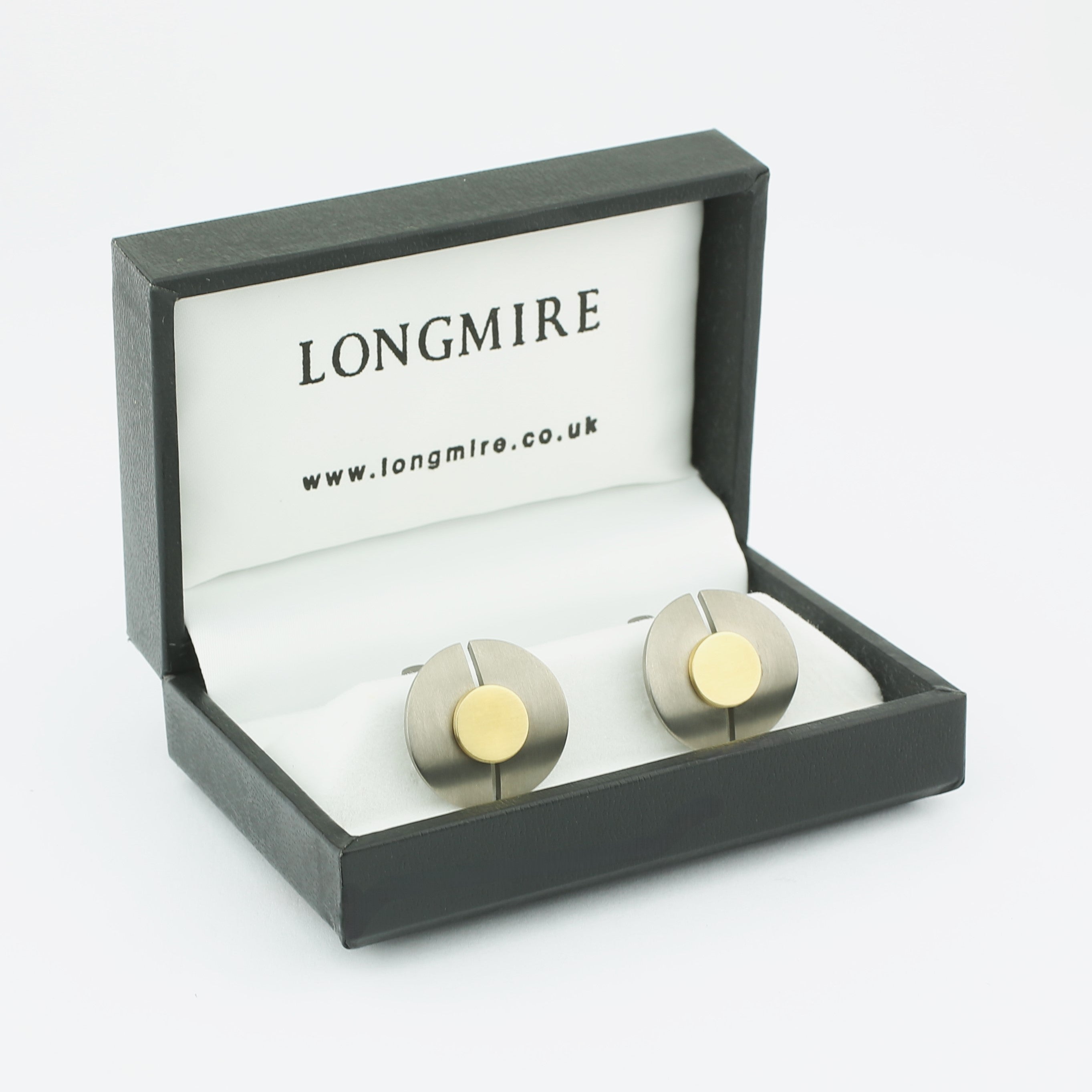 circle of titanium with a centre of 18ct yellow gold cufflinks - boxed