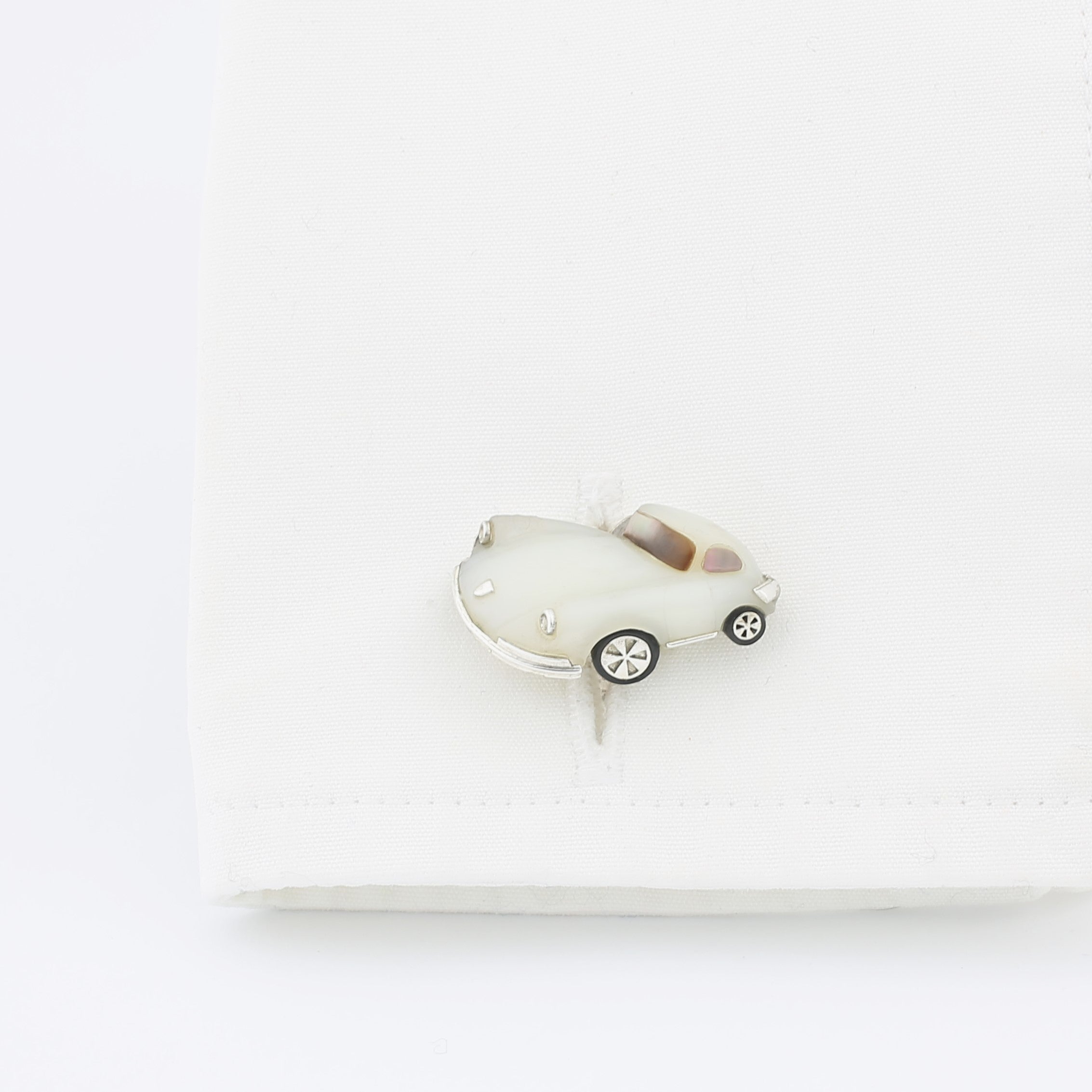 white opal sports car - cuff
