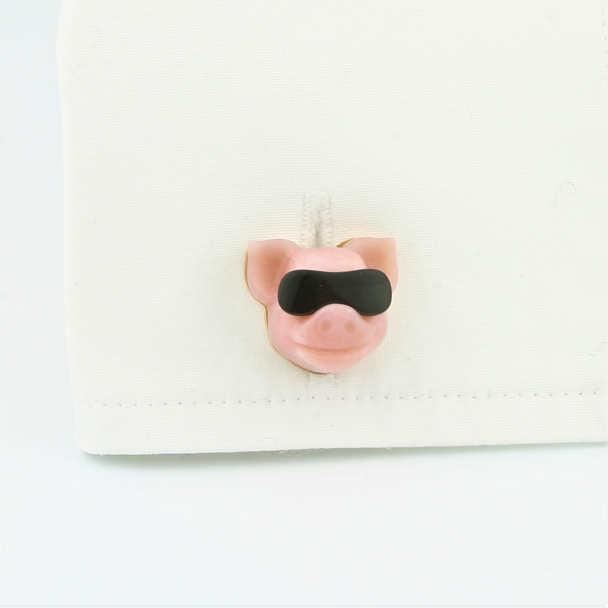 Cool pig cufflinks in 18k rose gold in a cuff