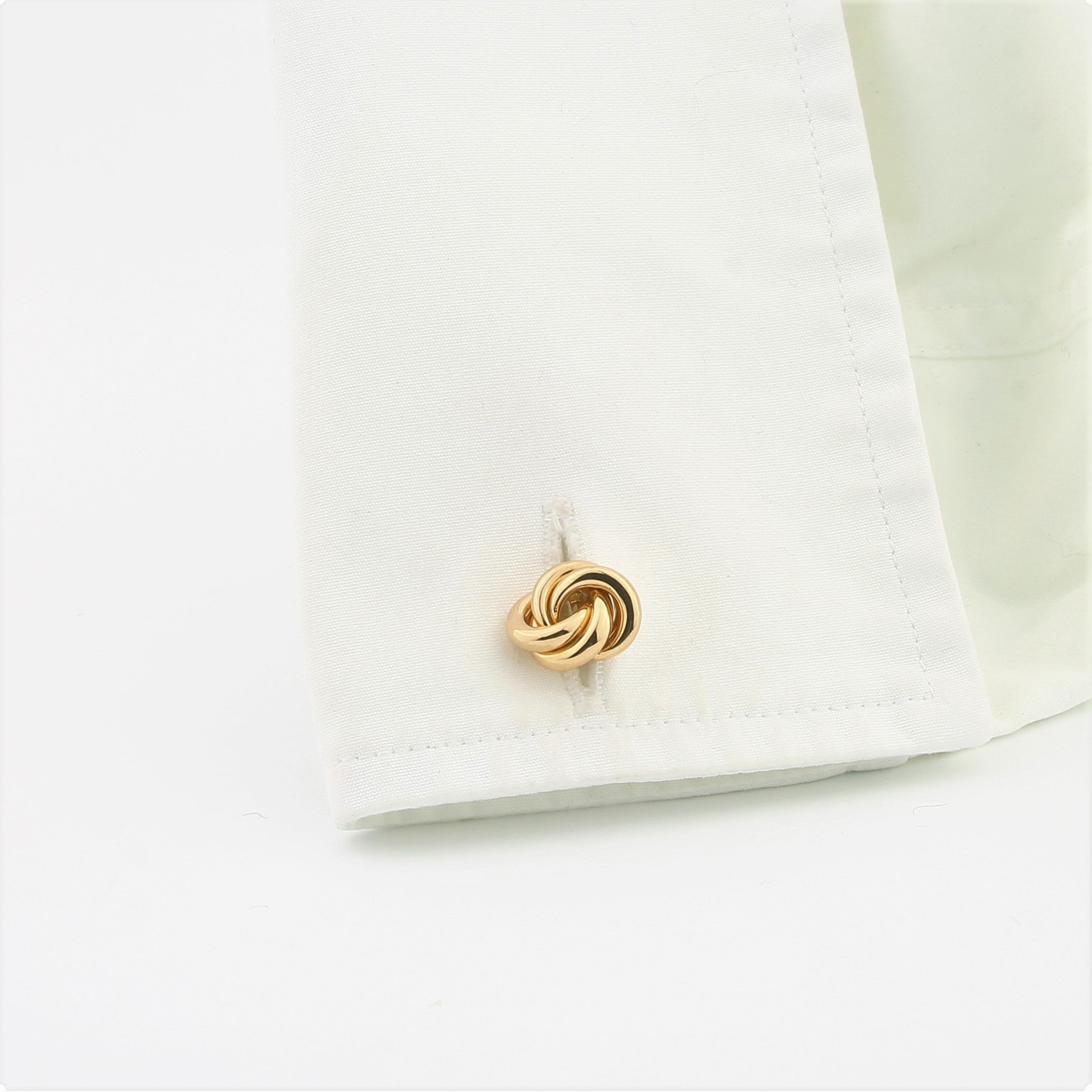 Classic knot cufflinks in 18k rose gold in a cuff