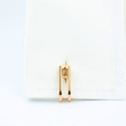 Double Stirrup cufflinks in 18k rose gold in a cuff