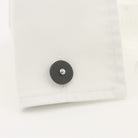 Onyx disc cufflinks 18k white gold in a cuff