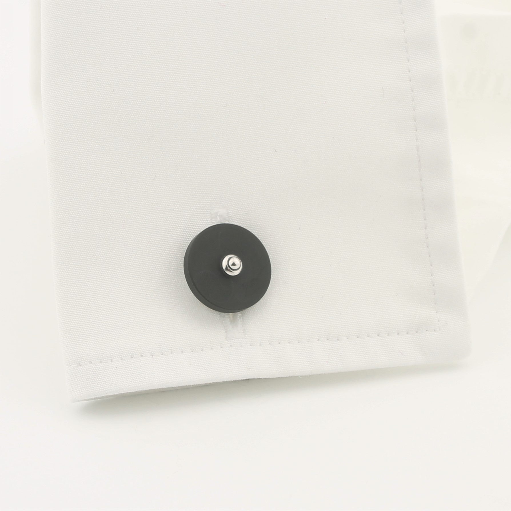 Onyx disc cufflinks 18k white gold in a cuff