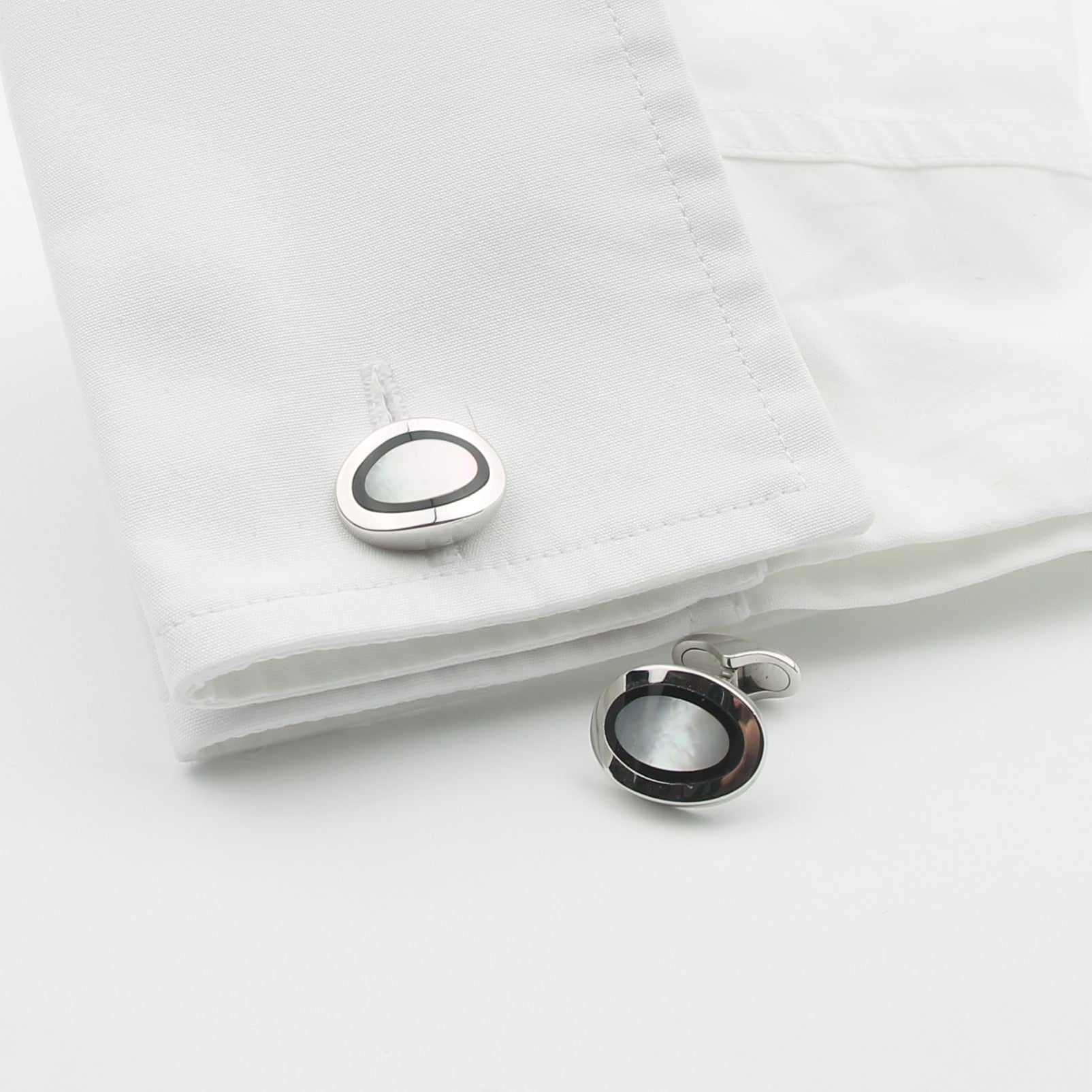 Onyx and mother of pearl cufflinks in a cuff