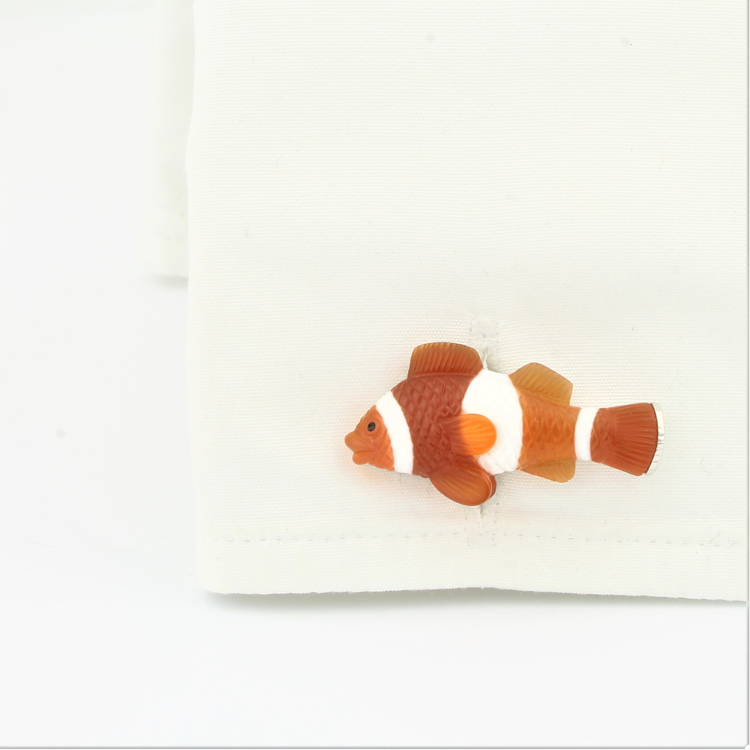 Clownfish cufflinks in 18k white gold in a cuff