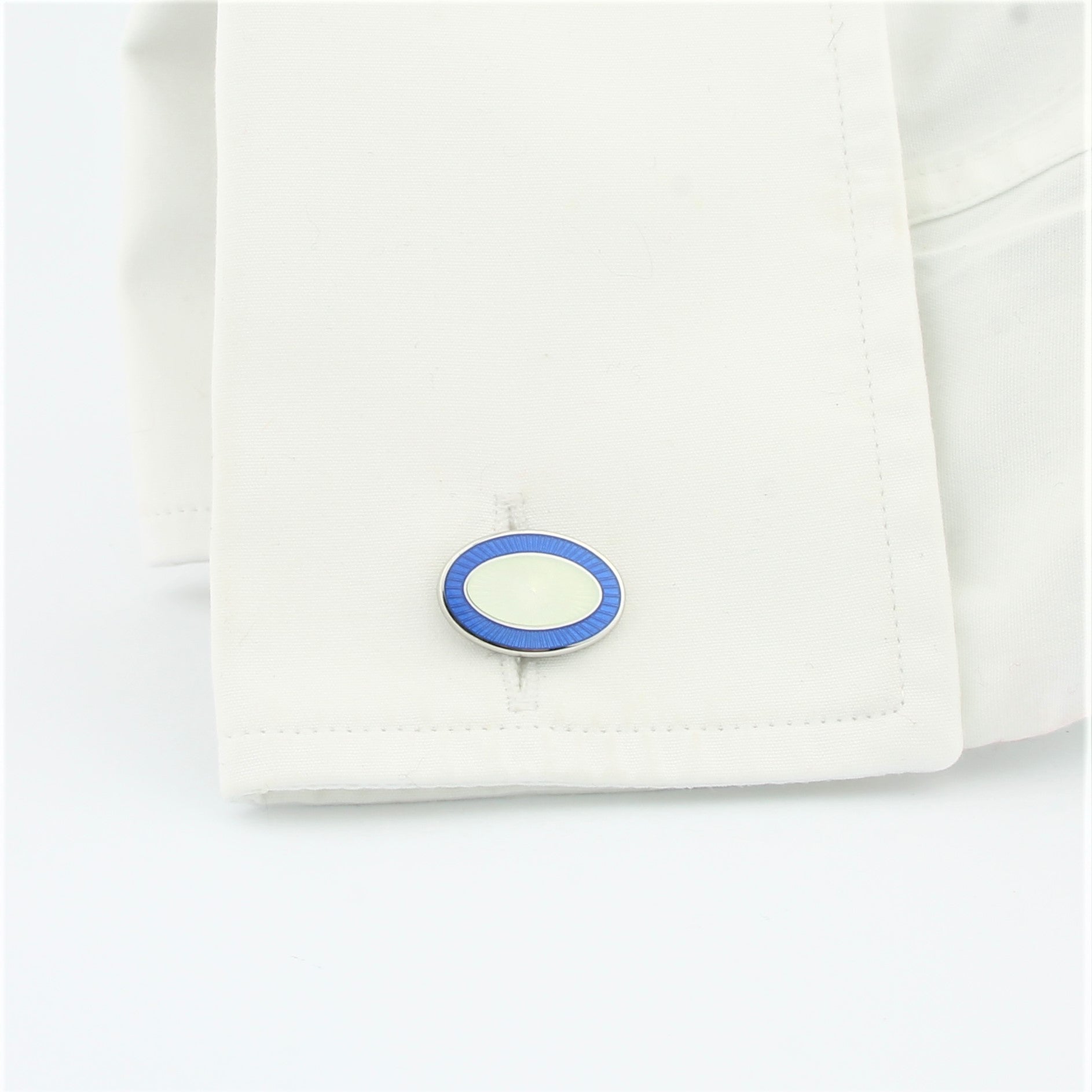 Double Oval Pale Blue/White cufflinks in a cuff