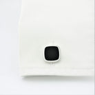 Onyx square cufflinks in silver in a cuff
