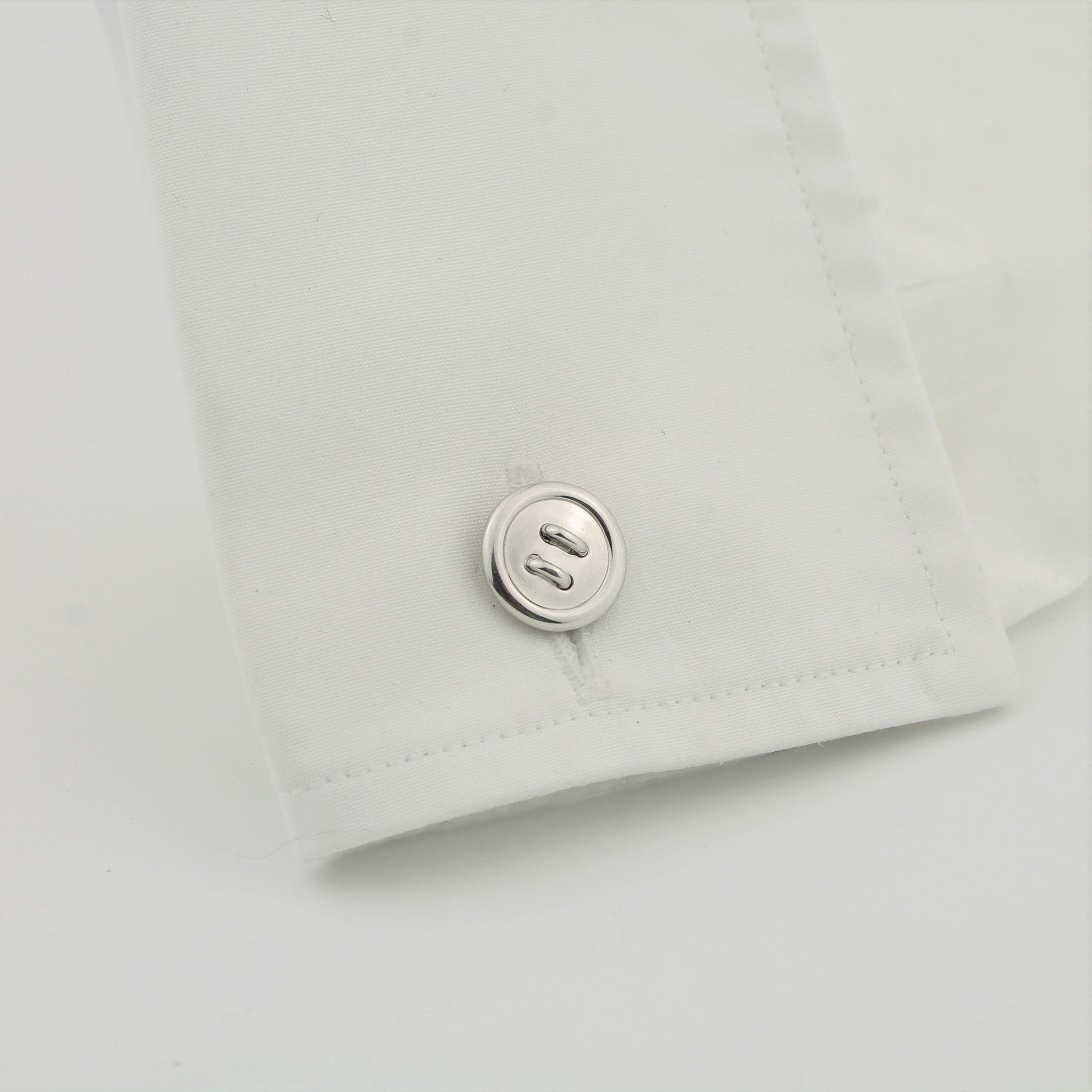 Longmire silver button cufflinks in a cuff