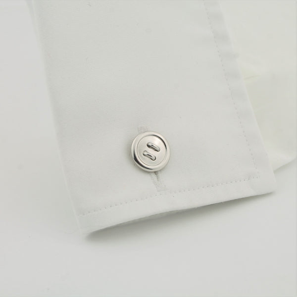 Longmire silver button cufflinks in a cuff