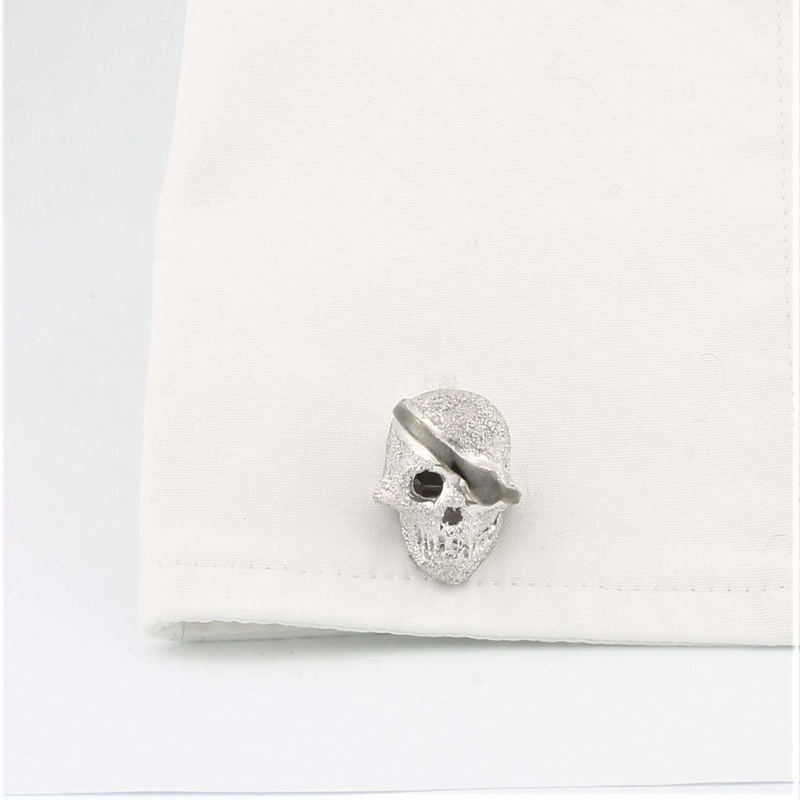 Skull cufflinks in silver in a cuff