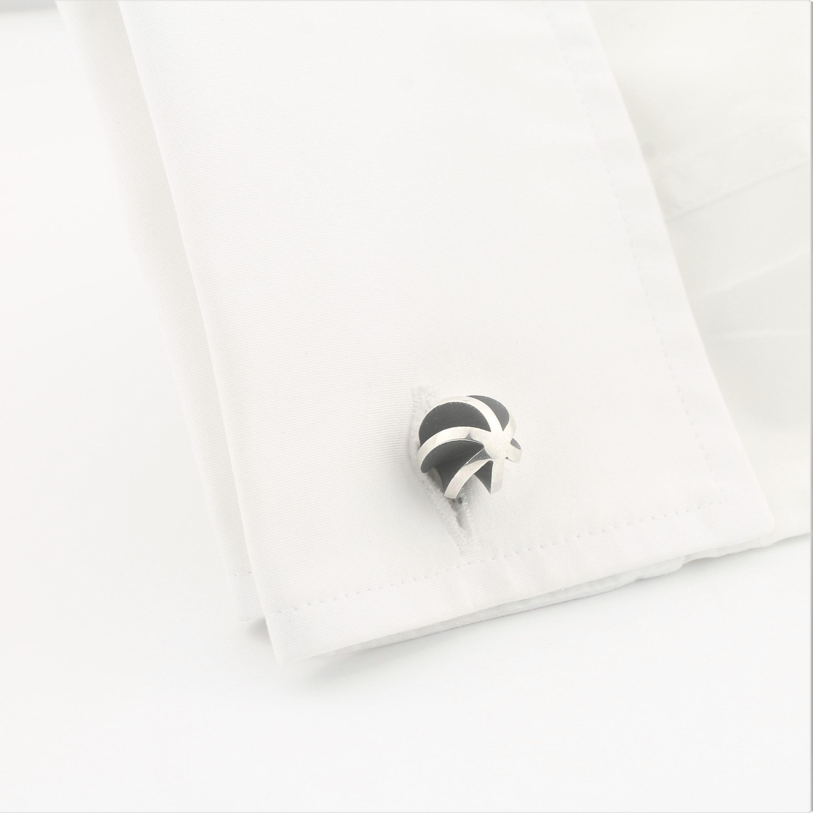 Twister design cufflinks in sterling silver in a cuff